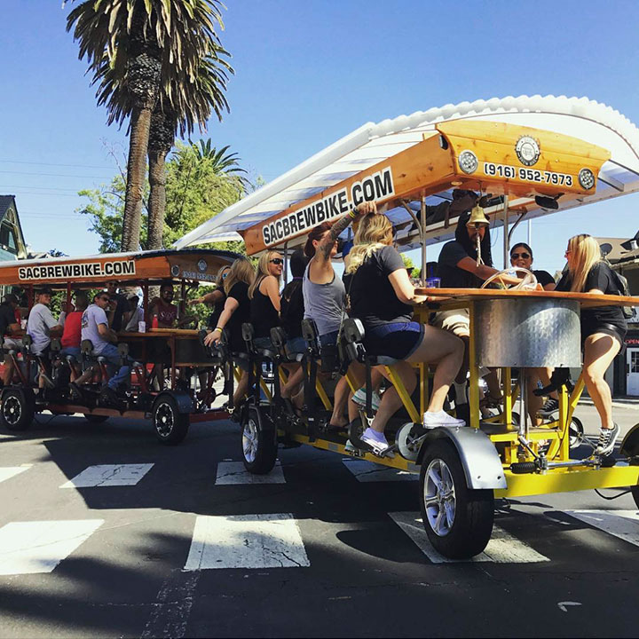 Co-workers team building on the Sac Brew Bike