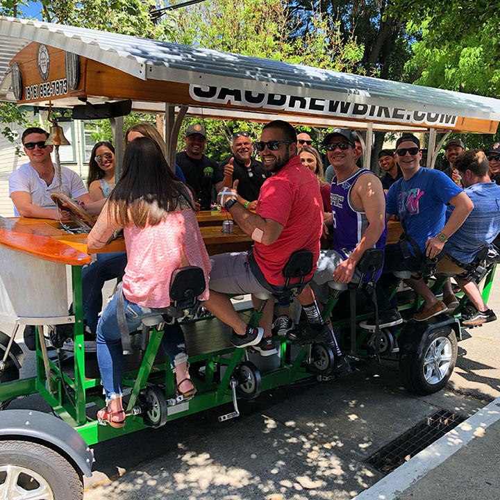 Co-workers team building on the Sac Brew Bike