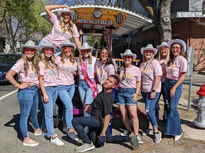 Bachelorette party celebration in pink shirts and cowboy hats